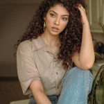woman in brown button up shirt and blue denim jeans