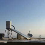 white satellite dish on gray concrete floor during daytime